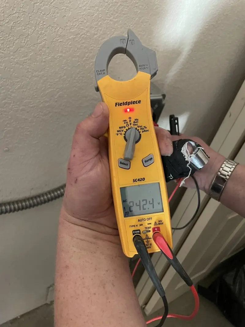 Voltage testing with clamp meter during Aluminum Wiring Replacement in Diboll